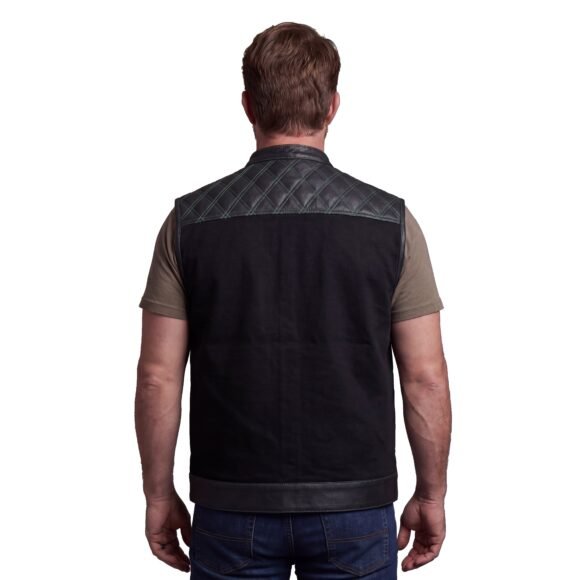 mens denim | leather motorcycle vest | conceal carry pockets | green stitching.